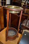 A turn of the century pub or tavern spittoon having coopered base and brass dish