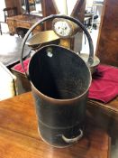 A vintage copper coal scuttle