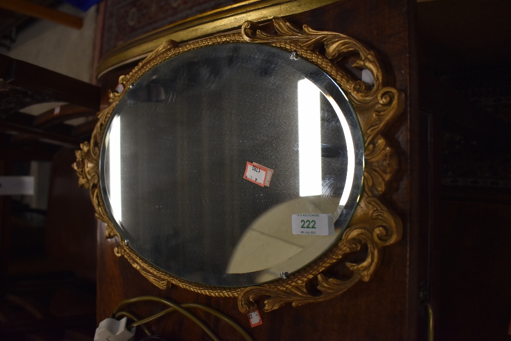 An Atsonia wall mounted mirror with gilt effect frame