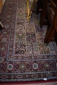A wool carpet square or rug in burgundy ground with floral design approx 2m x 2.5m