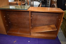 A vintage teak low bookcase