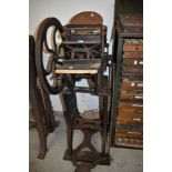 An industrial printers letter type set printing press by Peerless
