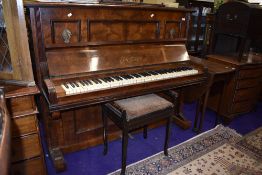 A 19th Century walnut cased upright piano , labelled for J G Irmler, Leipzig, and a stained frame