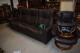 A modern Stressless three seater sofa settee and two arm chairs with foot stools in good condition