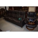 A modern Stressless three seater sofa settee and two arm chairs with foot stools in good condition