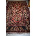A Turkish style hall or similar wool rug or carpet square having deep red ground