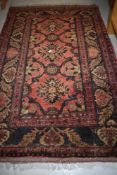 A Turkish style hall or similar wool rug or carpet square having deep red ground