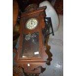 An antique wall mounted Vienna style wall clock made in the USA