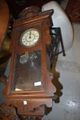 An antique wall mounted Vienna style wall clock made in the USA