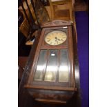 An early 20th Century oak cased wall clock