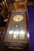 An early 20th Century oak cased wall clock