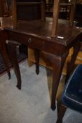 A hardwood side table having frieze drawer