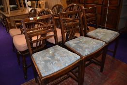 A set of three early 20th Century stained frame rail back dining chairs