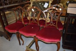 A set of six late 18th century mahogany framed dining chairs having carved backs on cabriole legs