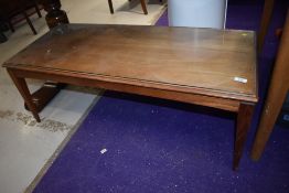 A vintage mid century teak coffee table