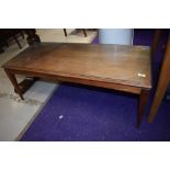 A vintage mid century teak coffee table