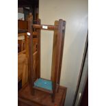 A rustic oak umbrella stand