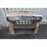 A vintage heavy plank top work or potting garden bench