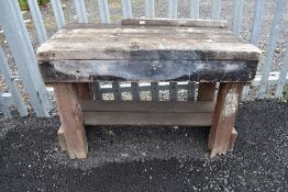 A vintage heavy plank top work or potting garden bench