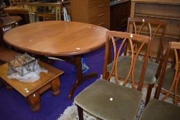 A vintage teak G Plan oval dining table and set of eight (six plus two) dining chairs