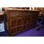 A vintage Priory/Old Charm style oak and ply sideboard, width approx. 133cm
