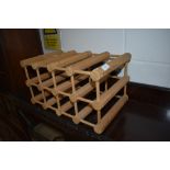 A pine kitchen wine rack