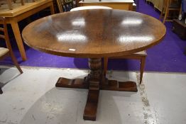 A good quality reproduction circular topped dining table, by Titchmarsh and Goodwin