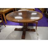 A good quality reproduction circular topped dining table, by Titchmarsh and Goodwin