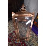A Copper wall light in the Victorian street lamp style, having cast wall mountings, perspex panes