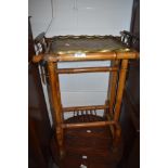 A Chinese tea table having brass chase worked dish top with gilt decorated bamboo frame