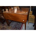 A late 19th or early 20th Century mahogany Pembroke table having frieze drawer on tapered legs and