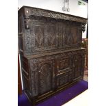 A Period oak court cupboard of large proportions, heavy carving/pokerwork decoration, width