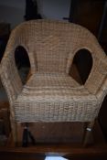 A pair of wicker conservatory or similar chairs