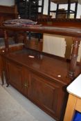 A late Victorian dresser buffet or side bar labelled by Maple having been presented by the Bersted