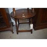 A traditional oak coffee table having circular top, diameter approx. 50cm