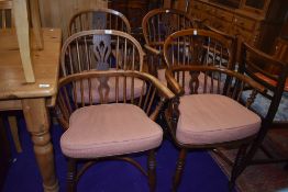A lovely Harlequin matched set of four Elm Windsor armchairs, having turned legs, crinoline