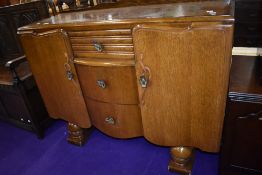 A mid 20th Century oak and ply sideboard, width approx. 122cm