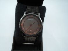 A gent's quartz wrist watch by Sekonda having a Roman numeral dial with date aperture to brown