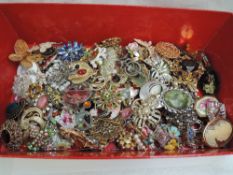 A large selection of costume brooches including ceramic, enamelled, bead etc