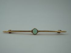 A yellow metal bar brooch stamped 15ct having a central opal stone, approx 3.3g