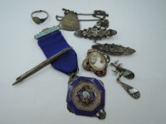 A small selection of HM silver and white metal jewellery including an enamelled medalion regarding