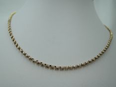 A yellow metal belcher chain stamped 14K, approx 22' & 7.1g