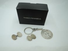A silver key ring by Theo Fennell bearing the emblem and a pair of silver cufflinks also by Theo