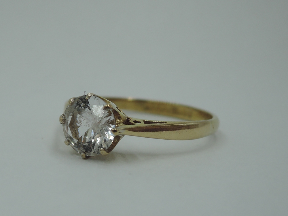 A cubic zirconia solitaire on a 9ct gold loop, size P & 1.9g
