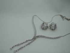 A Swarosvski crystal necklace and matched diamante set white metal hoop earrings