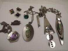 A selection of stainless steel jewellery including pendants, earrings, rings, LRI Borrowdale tie