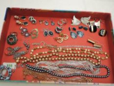 A selection of costume jewellery including simulated coloured pearls, dress rings, earrings etc