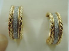 A pair of 9ct white and yellow gold hoop earrings, approx 1.8g