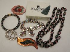 A selection of costume jewellery including an Artisan copper brooch by Sidney Beddall of