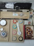 A small selection of costume jewellery including brooches, HM silver pocket watch (AF), cased